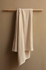 Fototapeta premium A rectangular towel that is beige with a hook linen simplicity coathanger.