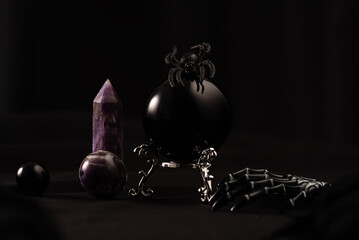 Divination ball, candles, skeleton and spider- a fall witch's Halloween scene.