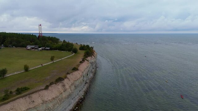 Aerial Video Panga Coastal Cliff and Lighthouse, Northern Shore of Saaremaa Island Near Kuressaare, Baltic Sea. Saaremaa, Estonia. 4K Panoramic Aerial Video of The Panga Cliffs