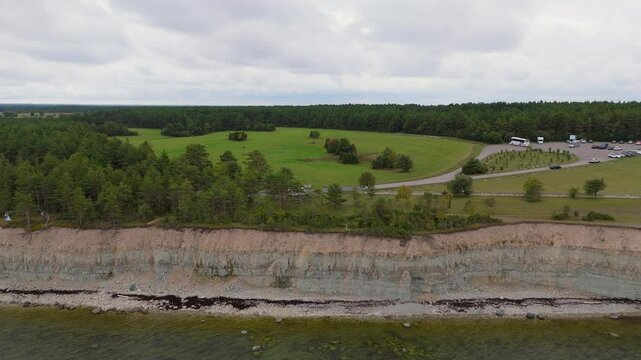 Aerial Video Panga Coastal Cliff and Lighthouse, Northern Shore of Saaremaa Island Near Kuressaare, Baltic Sea. Saaremaa, Estonia. 4K Panoramic Aerial Video of The Panga Cliffs