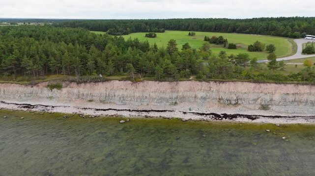 Aerial Video Panga Coastal Cliff and Lighthouse, Northern Shore of Saaremaa Island Near Kuressaare, Baltic Sea. Saaremaa, Estonia. 4K Panoramic Aerial Video of The Panga Cliffs