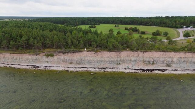 Aerial Video Panga Coastal Cliff and Lighthouse, Northern Shore of Saaremaa Island Near Kuressaare, Baltic Sea. Saaremaa, Estonia. 4K Panoramic Aerial Video of The Panga Cliffs