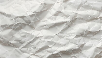 Fototapeta premium Crumpled white paper texture, suitable for backgrounds or design projects.