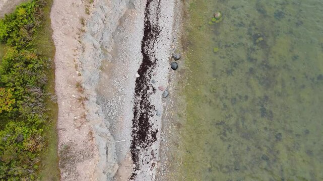 Aerial Video Panga Coastal Cliff and Lighthouse, Northern Shore of Saaremaa Island Near Kuressaare, Baltic Sea. Saaremaa, Estonia. 4K Panoramic Aerial Video of The Panga Cliffs