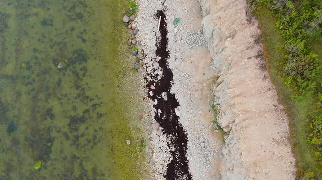 Aerial Video Panga Coastal Cliff and Lighthouse, Northern Shore of Saaremaa Island Near Kuressaare, Baltic Sea. Saaremaa, Estonia. 4K Panoramic Aerial Video of The Panga Cliffs