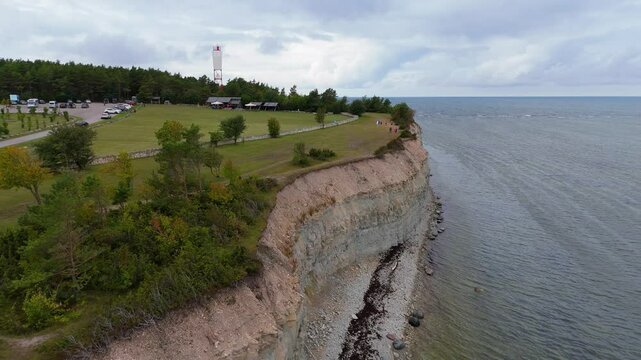 Aerial Video Panga Coastal Cliff and Lighthouse, Northern Shore of Saaremaa Island Near Kuressaare, Baltic Sea. Saaremaa, Estonia. 4K Panoramic Aerial Video of The Panga Cliffs