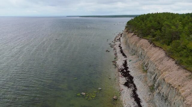 Aerial Video Panga Coastal Cliff and Lighthouse, Northern Shore of Saaremaa Island Near Kuressaare, Baltic Sea. Saaremaa, Estonia. 4K Panoramic Aerial Video of The Panga Cliffs