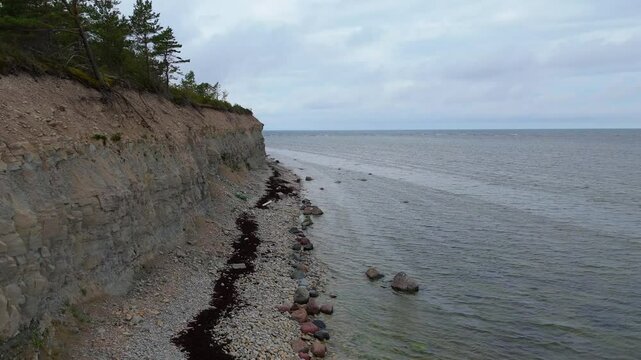 Aerial Video Panga Coastal Cliff and Lighthouse, Northern Shore of Saaremaa Island Near Kuressaare, Baltic Sea. Saaremaa, Estonia. 4K Panoramic Aerial Video of The Panga Cliffs