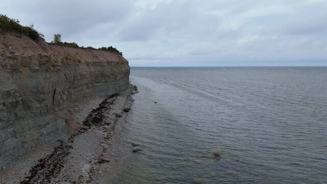 Aerial Video Panga Coastal Cliff and Lighthouse, Northern Shore of Saaremaa Island Near Kuressaare, Baltic Sea. Saaremaa, Estonia. 4K Panoramic Aerial Video of The Panga Cliffs
