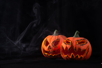 Halloween event background with pumpkins and smoke , greetings and Halloween celebrations.