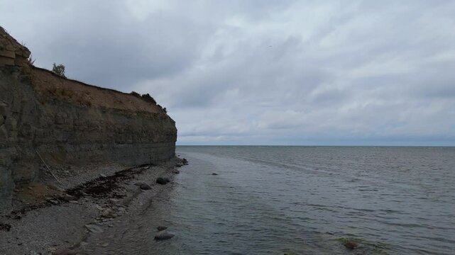 Aerial Video Panga Coastal Cliff and Lighthouse, Northern Shore of Saaremaa Island Near Kuressaare, Baltic Sea. Saaremaa, Estonia. 4K Panoramic Aerial Video of The Panga Cliffs