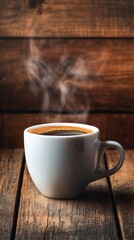 Fototapeta premium A steaming cup of coffee on a wooden surface, inviting warmth and comfort.