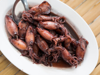Sauteed black squid is processed squid that is cooked until the squid ink is released. The resulting taste is very distinctive. Processed squid. Thai seafood style.