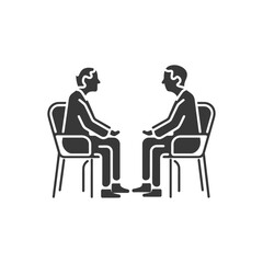 Two People Sitting in Chairs Facing Each Other