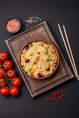 Boiled wheat bulgur porridge with vegetables peppers, peas, corn