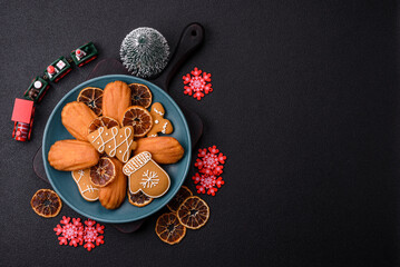 French classic madeleine sponge cake with elements of Christmas motifs