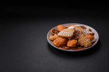 French classic madeleine sponge cake with elements of Christmas motifs