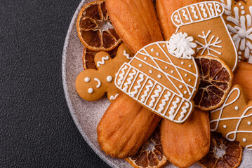 French classic madeleine sponge cake with elements of Christmas motifs