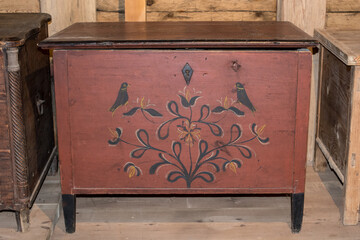 Old wooden chest against wooden wall