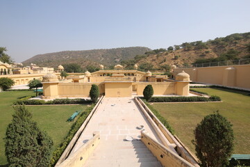 Vidyadhar Garden Jaipur, Rajasthan India November 2018. A pictures with greenery, fountains, mountains, peacock paintings and structures, showcasing a unique blend of Mughal and Rajput architecture.
