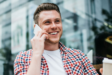 Happy man with cup of coffee in hand