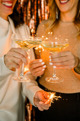 Crop couple with champagne glasses