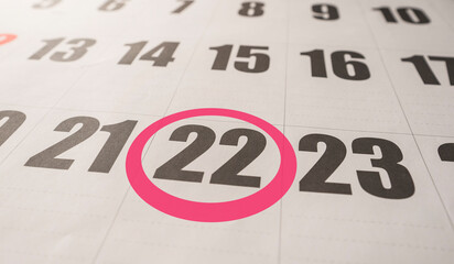 22nd day of the month in the calendar highlighted. 22nd day of the month marked with a red circle. Twenty-second day of the month marked.