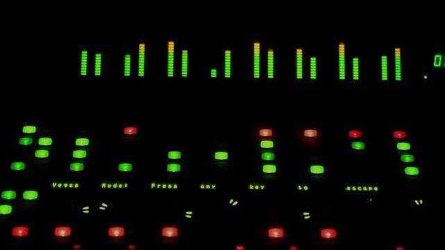 A blinking light of a button knob area and sound metrix meter level was running of a sound mixer panel control.