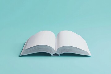 Obraz premium Open book with blank pages on a light blue background for creative design mockups and presentations