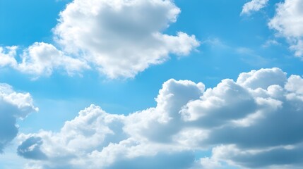 Beautiful fluffy clouds drifting lazily across a bright blue sky, with ample copy space for text overlay