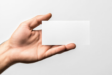 Obraz premium Blank White Card in Hand, Ready for Custom Message or Logo