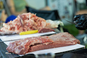 Preparing meat for the BBQ; barbecue; meat; cut of meat; red meat; slicing; competition; BBQ competition