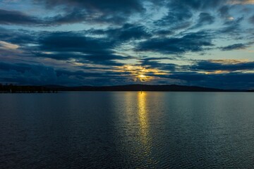 Serene sunset over a calm lake Vasman in Ludvika.