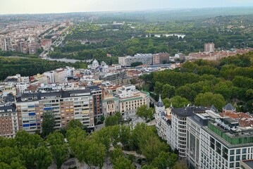 Aerial view of Madrid with historic and modern buildings.