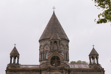 View of Mother See of Holy Etchmiadzin Apostolic Church  dome in Armenia against a white sky