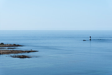 Views of the sea and rocks from the top of the Eckmühl lighthouse in Penmarch, France