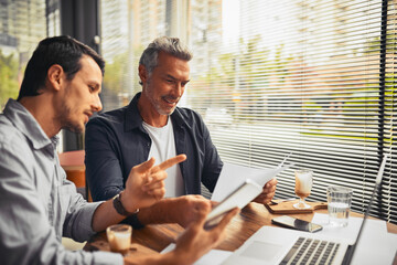Meeting, tablet or business people in coffee shop for paperwork, teamwork or financial investment....