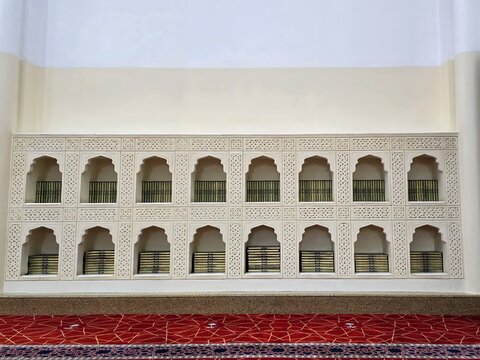 Madinah, Saudi Arabia, Stacks of the holy Quran on shelf in Masjid.