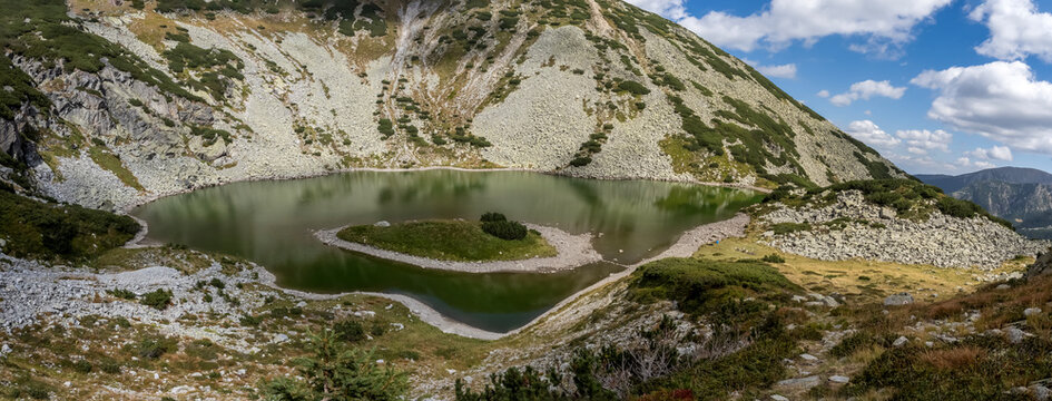 Panoramic view of The Goat lake ( Taul Tapului ) in National Park Retezat, Romania. This is considered the most beautiful glacial lake in Romania.