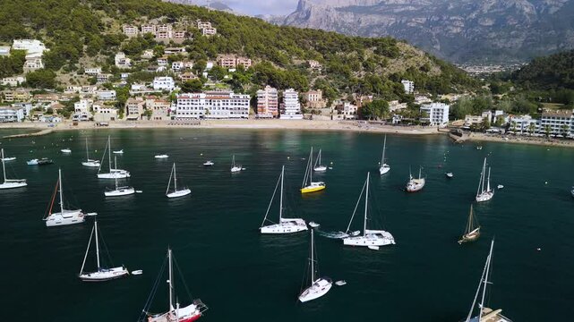 Aerial view of Port de Soller coastal town with luxury boats, Mallorca