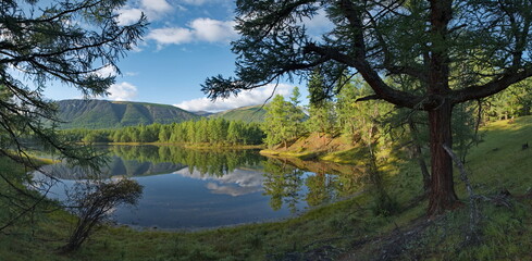 Russia, Western Buryatia. Early morning on the deserted taiga lake Guzen-Nur on the left bank of the Tisza River.
