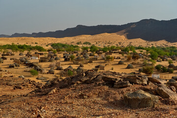 West Africa, Mauritania. View of the village of Guelta with houses of traditional architecture, located near an oasis in the middle of the stone desert in the south-west of the Sahara.