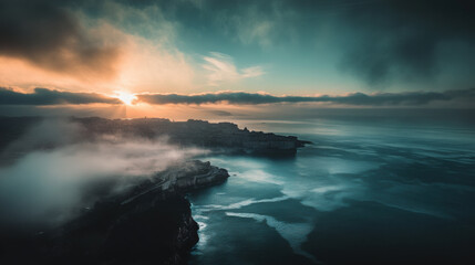 Fototapeta premium A breathtaking view of coastal landscape at sunrise, with mist hovering over water and serene atmosphere. soft light reflects on calm sea, creating tranquil scene