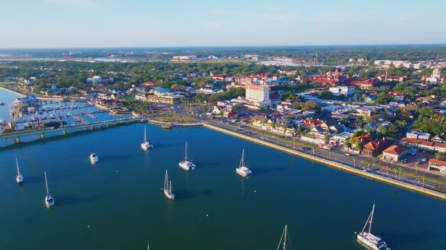 Aerial fly in to city of St. Augustine, Florida over river