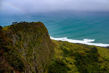 Stunning scenic viewpoint on the edge of a rugged cliff overlooking the Te Toto Gorge, Raglan, New Zealand