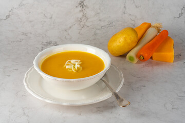 Pumpkin cream bowl with fresh ingredients.