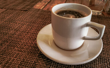 Cup of americano black coffee in restaurant cafe in Mexico.