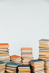 lots of old stacks of educational books on a white background of the library