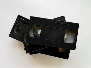 Stack of retro vhs tapes on light background showcasing vintage media technology