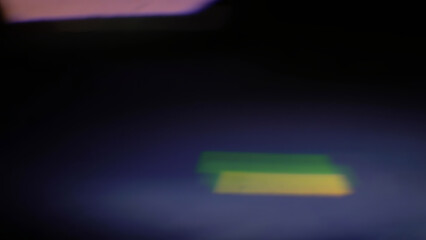 Cinematic anamorphic lens flares with vivid light streaks and reflections against a black background, creating a dynamic and glowing optical effect.